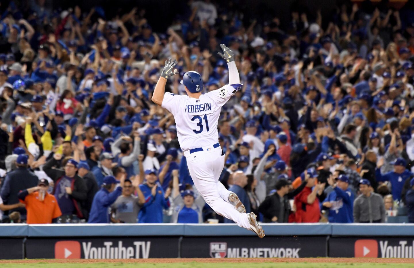Joc Pederson celebrates his solo home run against the Astros in the seventh inning.
