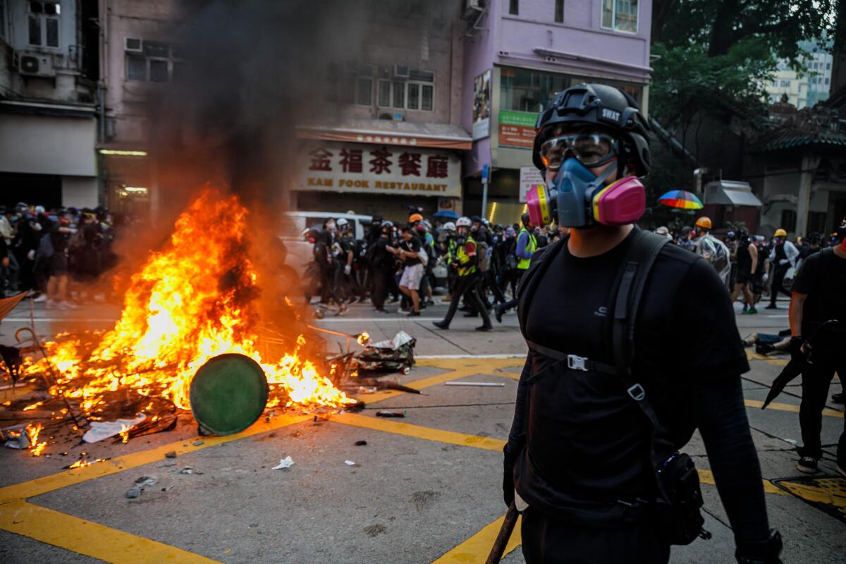 Pro-democracy demonstrators in Hong Kong retreat as police advance.