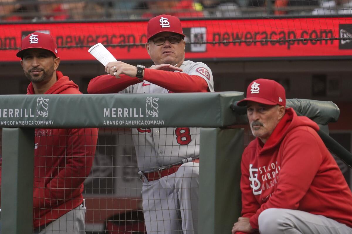 St. Louis Cardinals manager Mike Shildt, middle, watches from the dugout.