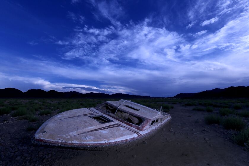 LAKE MEAD NATIONAL RECREATION AREA , NEV. - AUG. 23, 2022. A sunken boat that sat underwater for years has been exposed as the water of Lake Mead continues to recede in the face of relentless drought. Lake Mead is the largest reservoir in the United States. It stores water from the Colorado River, and the water is allocated to millions of people in the river's lower basin. ( Luis Sinco / Los Angeles Times)