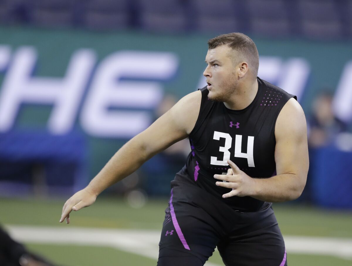 Scott Quessenberry performs a drill during the NFL scouting combine.