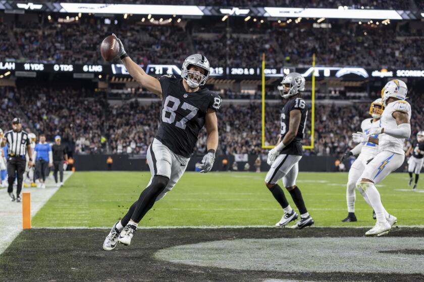 Raiders tight end Michael Mayer (87) celebrates his touchdown catch against the Chargers.