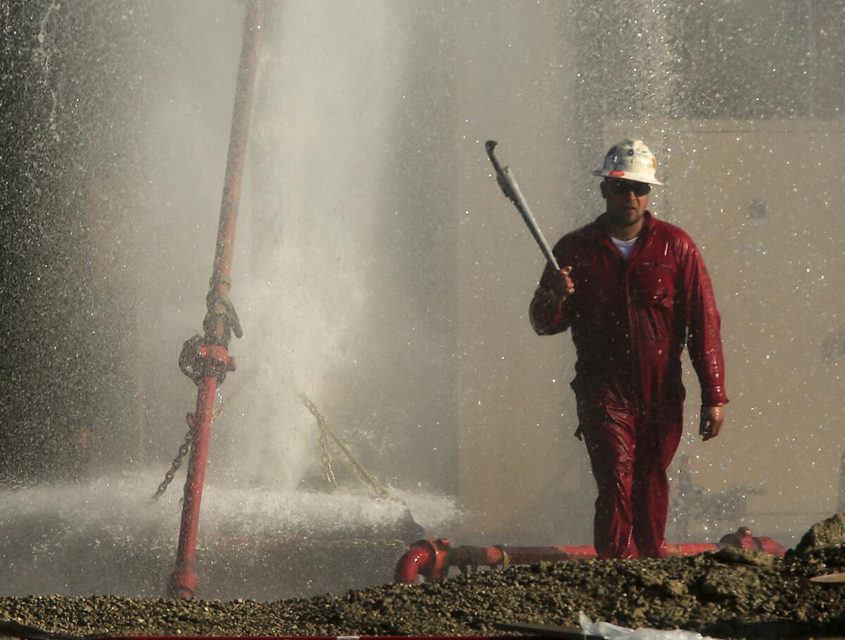 A damaged water well in Hawthorne continues to spew a mixture of water and methane as a crew works to cap the well.