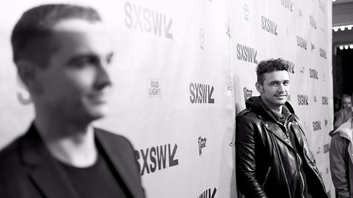 James Franco eyes his brother Dave on the press line at the SXSW premiere of their film, "The Disaster Artist."