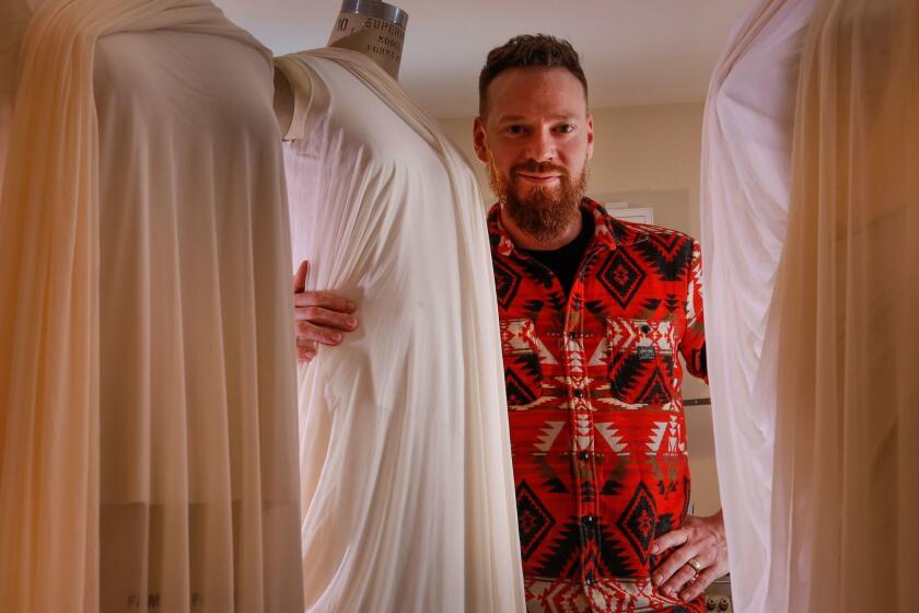 Bradon McDonald stands among dress forms for ongoing projects in his Los Angeles home studio. His work for Jessica Lang Dance can be seen Friday through Sunday at the Music Center.