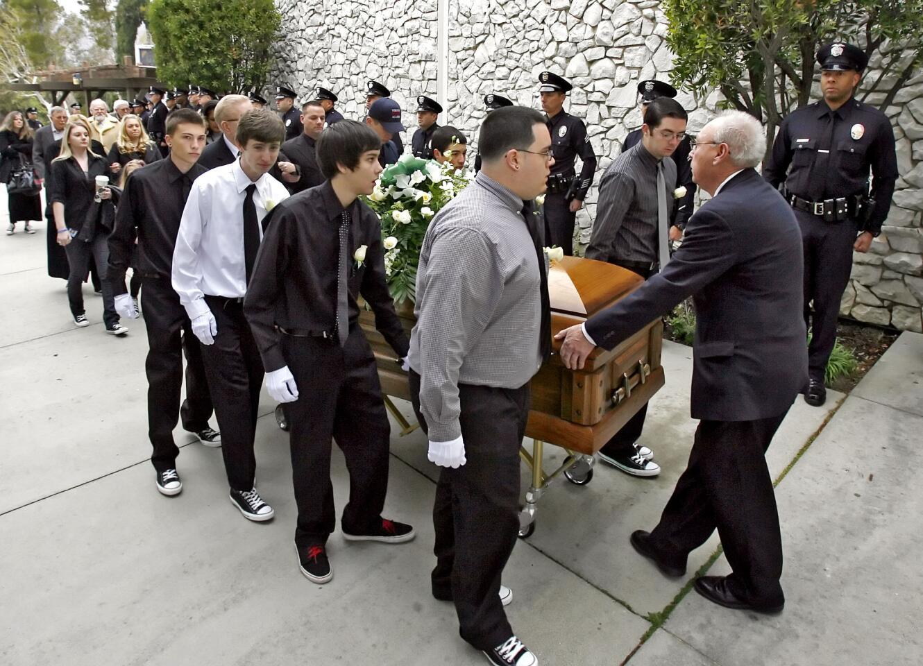 The body of 15-yr. old Drew Ferraro is brought in to Our Lady of Lourdes Church for funeral services in Tujunga on Wednesday, February 15, 2012. Ferraro jumped to his death from the roof of a Crescenta Valley High School building, where he was a sophomore, last Friday.