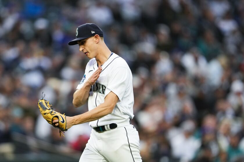 Seattle Mariners starting pitcher George Kirby reacts after striking out New York Yankees' Kyle Higashioka to retire the side during the eighth inning of a baseball game Wednesday, May 31, 2023, in Seattle. (AP Photo/Lindsey Wasson)