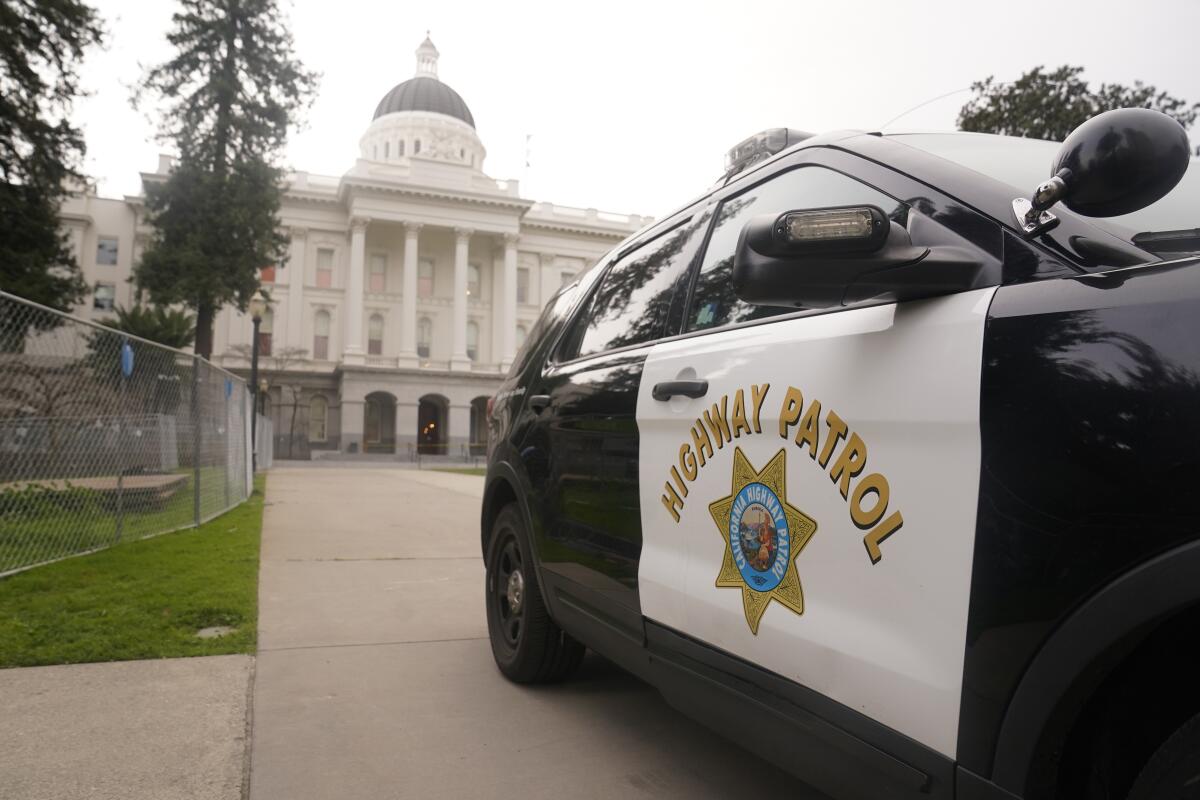 A California Highway Patrol vehicle is parked outside the state Capitol in Sacramento.