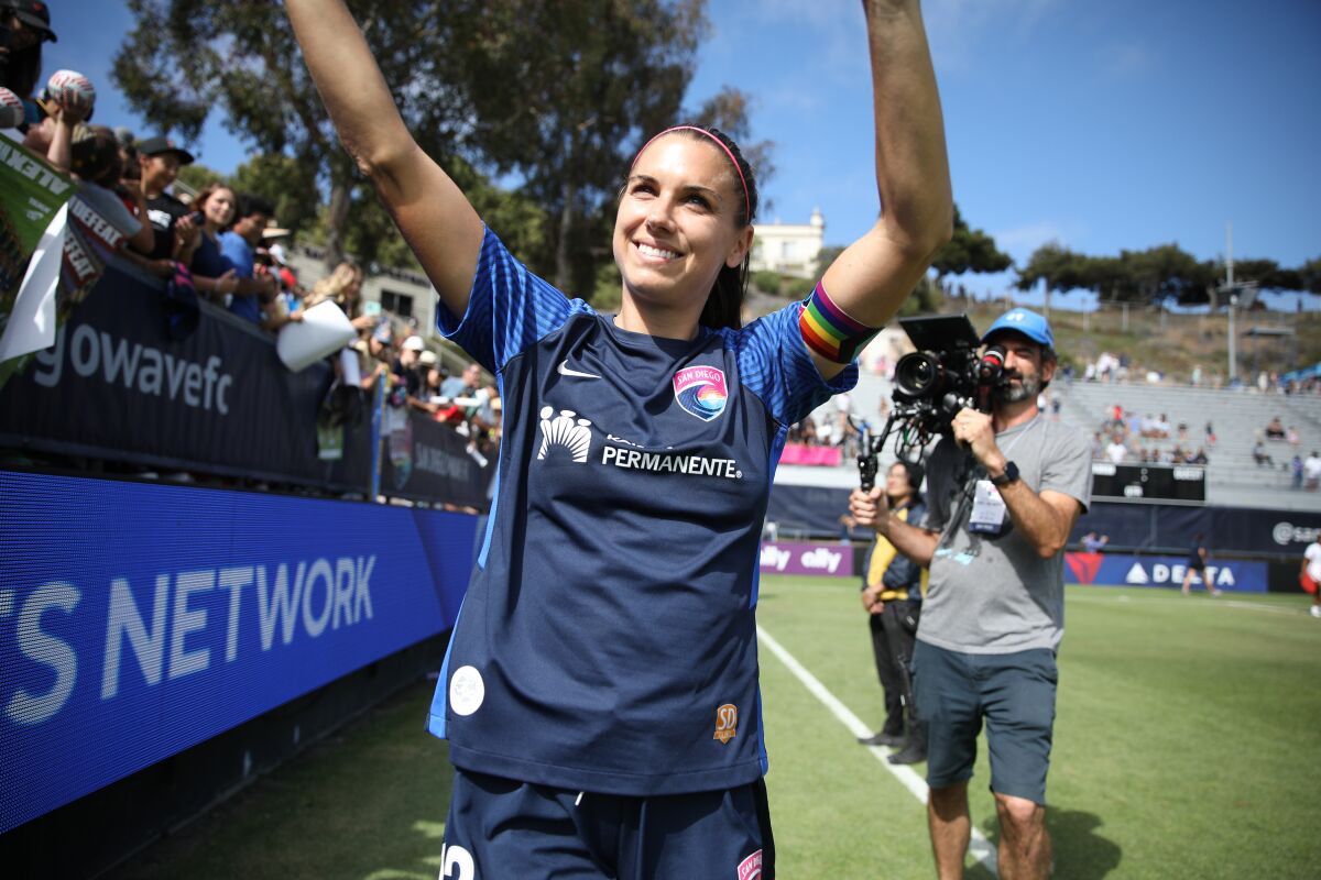 San Diego Wave FC forward Alex Morgan waves to fans at Torero Stadium in USD on Sunday, June 12, 2022.