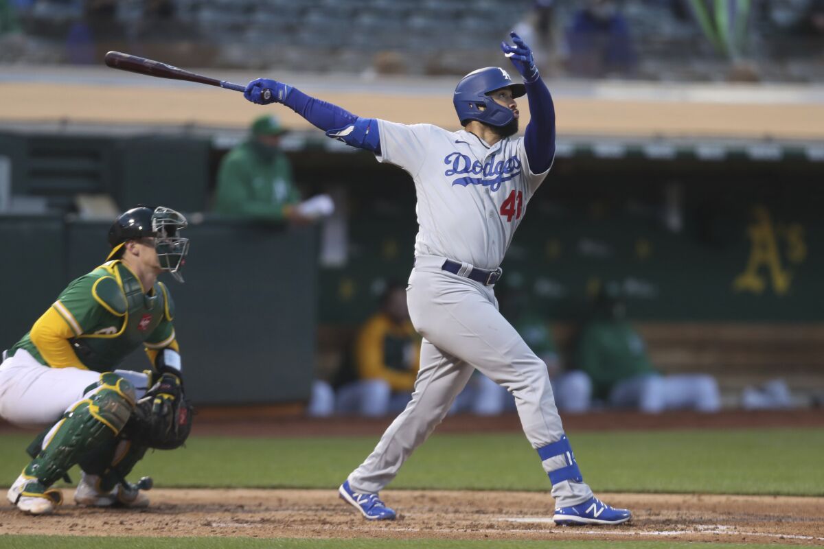 Edwin Ríos hits a home run against the Oakland Athletics in April 2021.