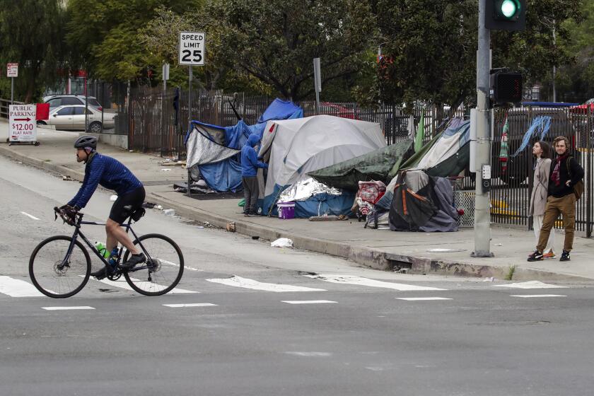 Los Angeles, CA - January 15: A homeless encampment on sidewalk that doesn't leave space for wheel chairs along Arcadia Street on Saturday, Jan. 15, 2022 in Los Angeles, CA. (Irfan Khan / Irfan Khan)