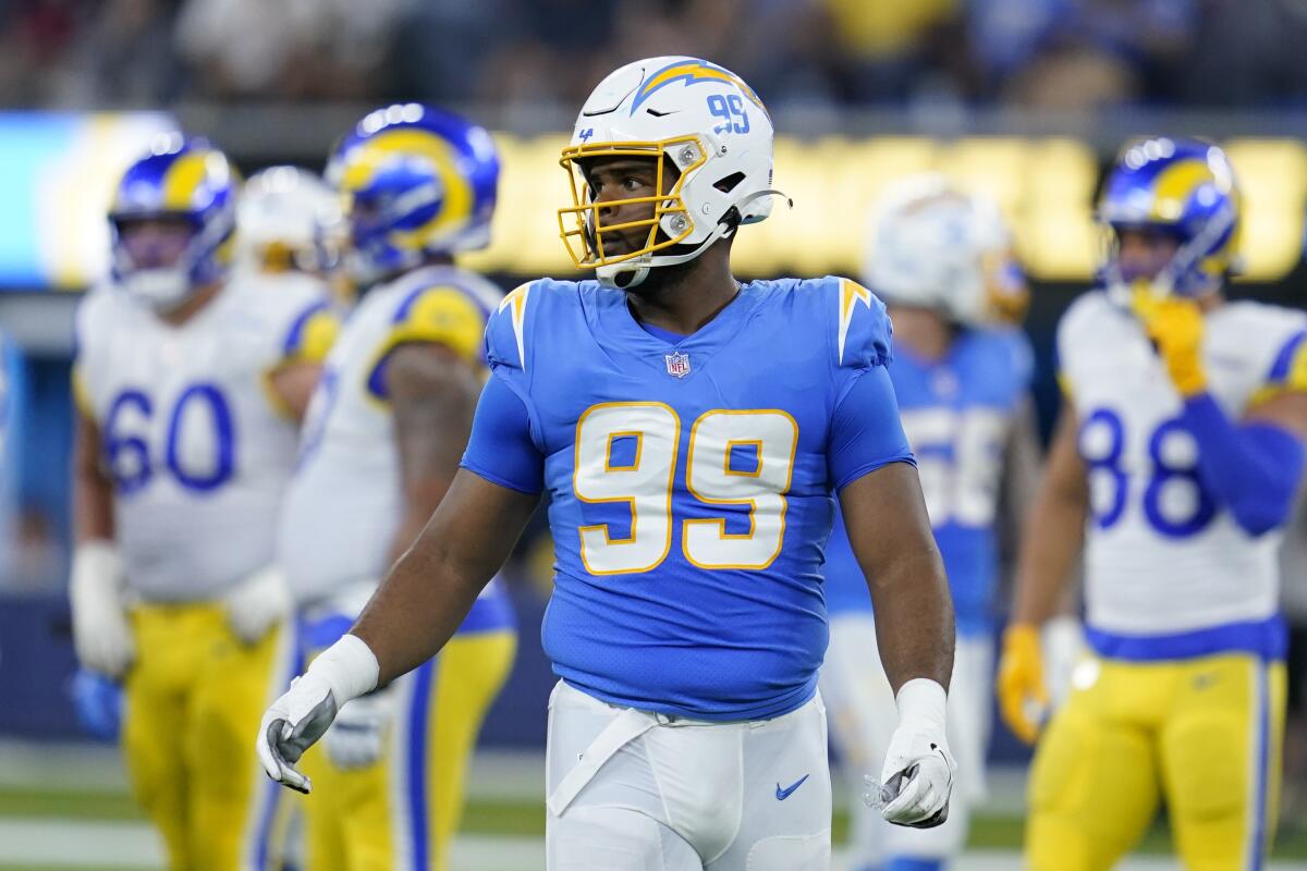 Former Chargers defensive lineman Jerry Tillery stands on the field during a game.