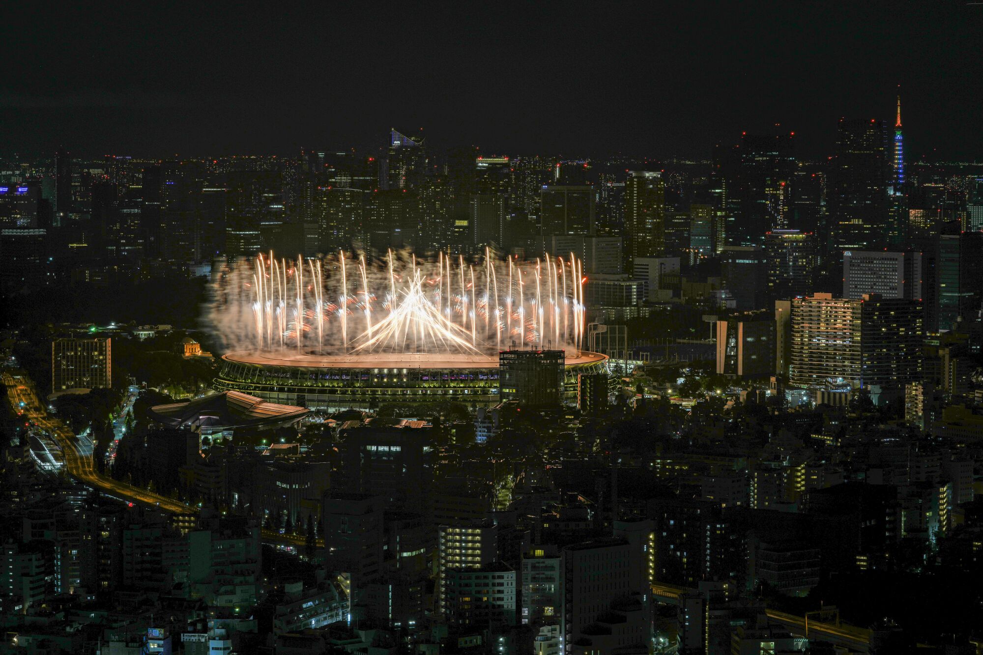 Fireworks illuminate over National Stadium during the opening ceremony of the Tokyo Olympics.