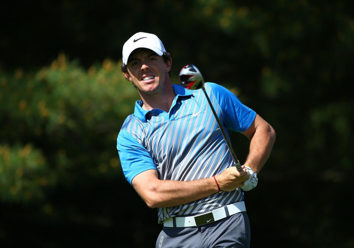 Rory McIlroy, nursing a sore knee, was 7-over par through 14 holes Friday at Muirfield Village Golf Club in Ohio.