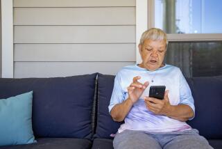 Sheri Wilkins talks about her experience using the DailyPay app outside of the clubhouse at her apartment complex in College Station, Texas on Tuesday, March 26, 2024. (AP Photo/Sam Craft)