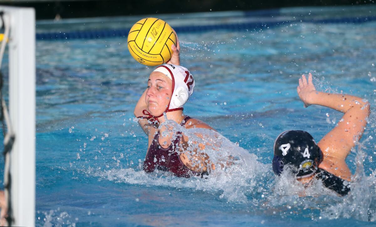 Laguna Beach High girls' water polo player Molly Renner takes a shot on goal on Wednesday.