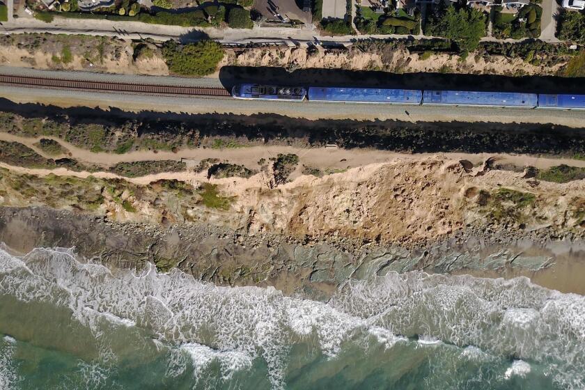 DEL MAR, CA. DEC 11, 2018,-For the fourth time this year the bluffs above the beach in Del Mar between 9th and 10th streets have stuffed off on to the beach below. Officials are worried that the continuing erosion is putting the train tracks that sit close to the cliffs edge in jeopardy. PHOTO/JOHN GIBBINS Staff photographer, San Diego Union-Tribune. ©2018