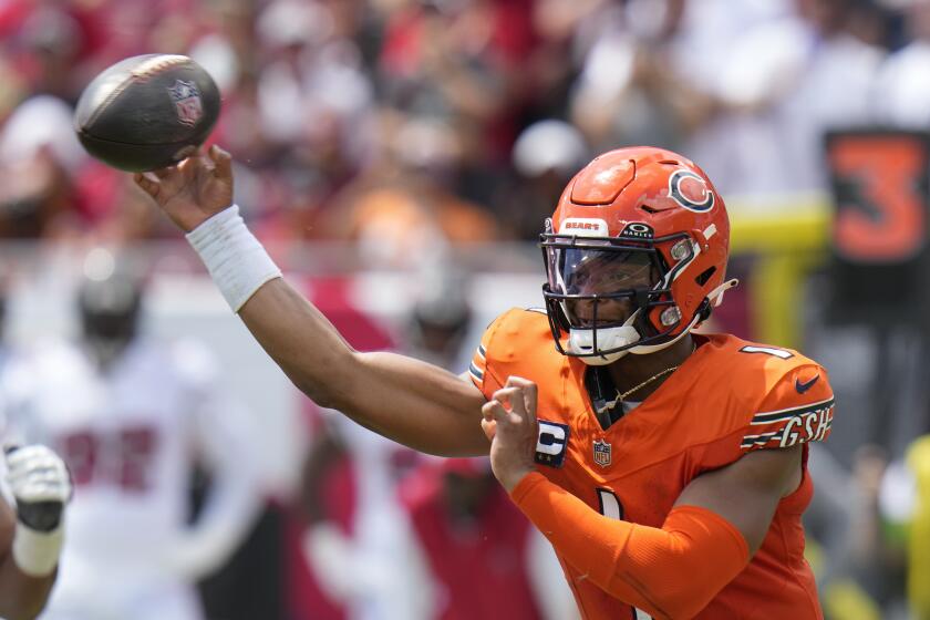 Chicago Bears quarterback Justin Fields (1) throws a pass during the first half of an NFL football game against the Tampa Bay Buccaneers, Sunday, Sept. 17, 2023, in Tampa, Fla. (AP Photo/Chris O'Meara)