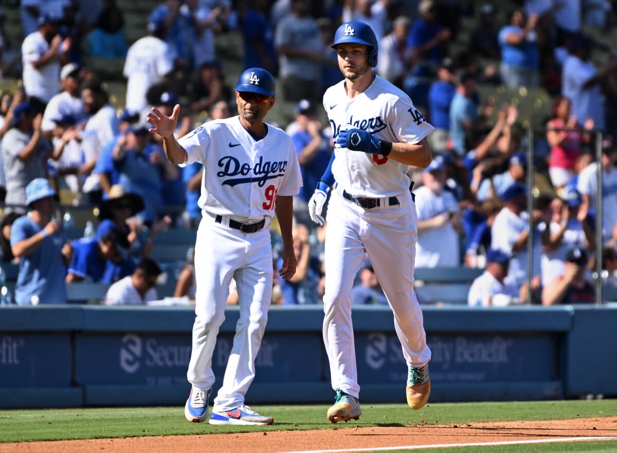 Dodgers shortstop Trea Turner heads for the plate after his home run Wednesday against the Colorado Rockies.