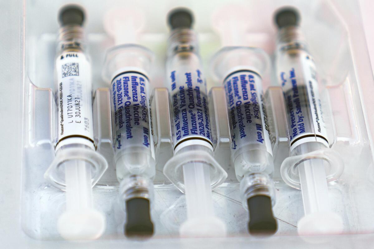 Flu vaccine syringes in a tray