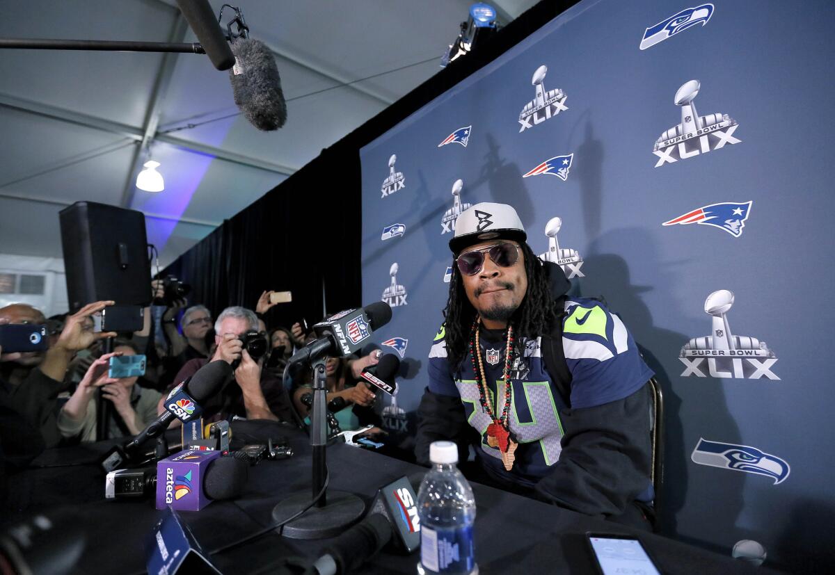 Marshawn Lynch attends a news conference Wednesday ahead of Super Bowl XLIX.