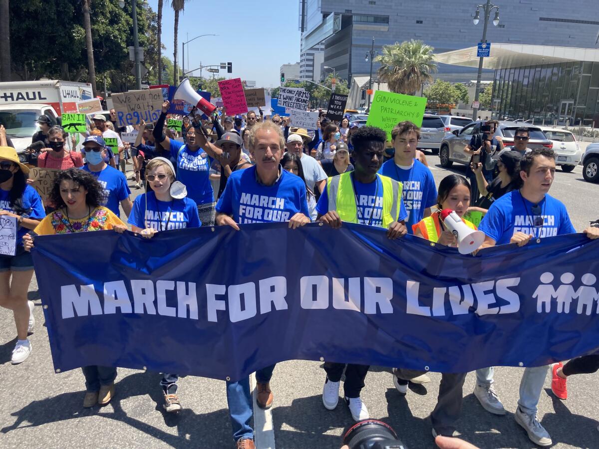 Protesters march during the March For Our Lives rally in downtown Los Angeles on June 11, 2022. 