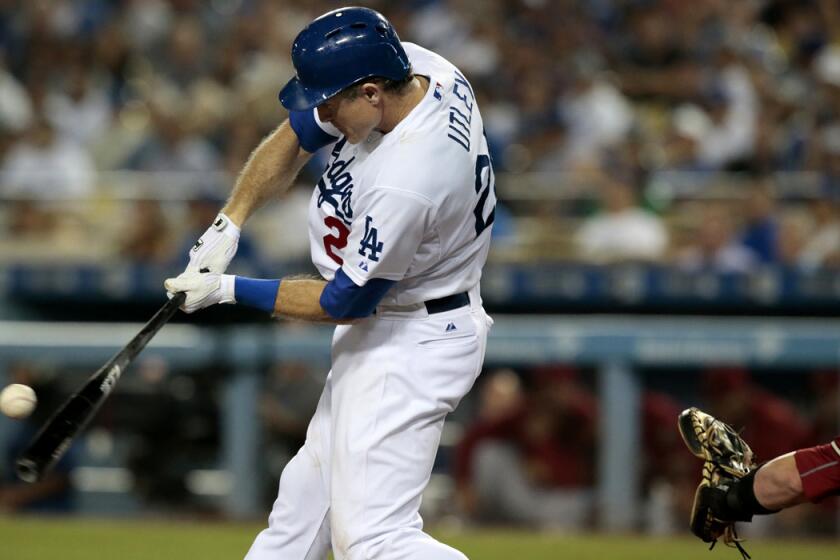 Dodgers second baseman Chase Utley connects for an RBI double against the Arizona Diamondbacks at Dodger Stadium on Sept. 23.