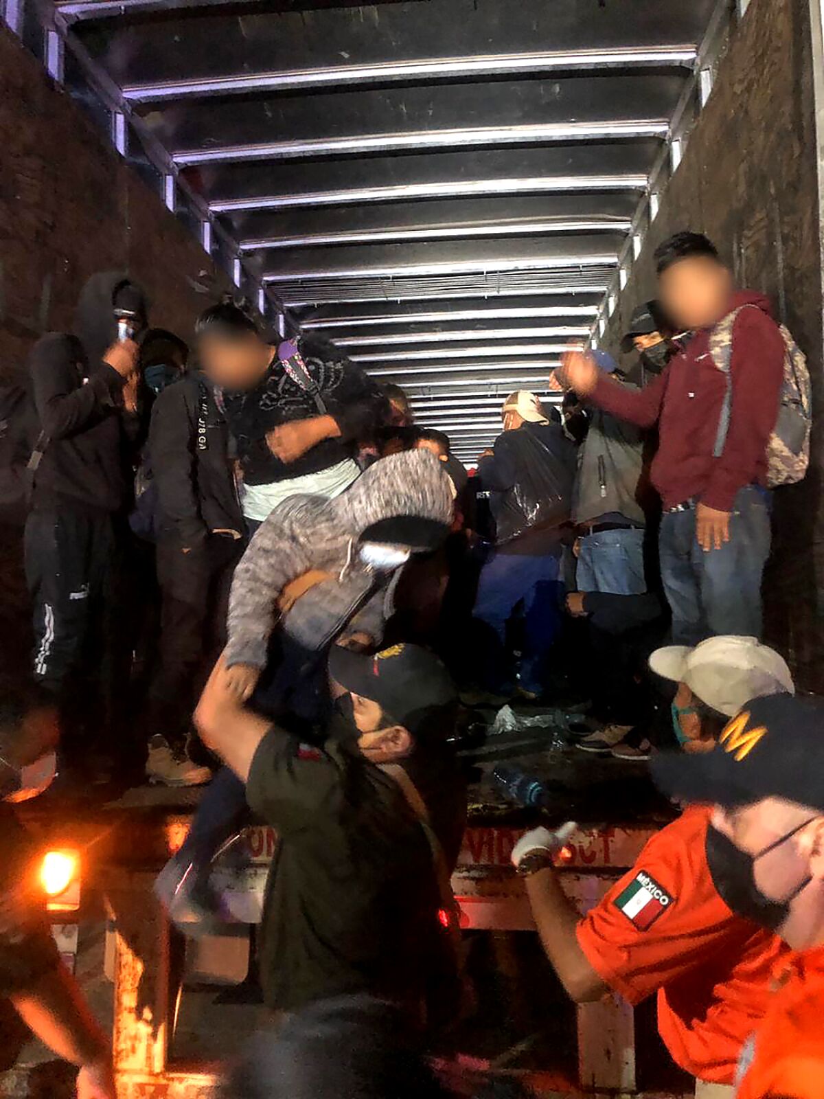 Police rescue 201 migrants in the back of a big rig in Mexico's southern Chiapas state