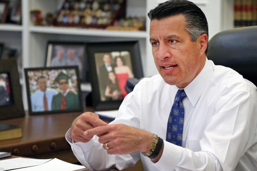 Nevada Gov. Brian Sandoval in his office in Carson City in April 2015.