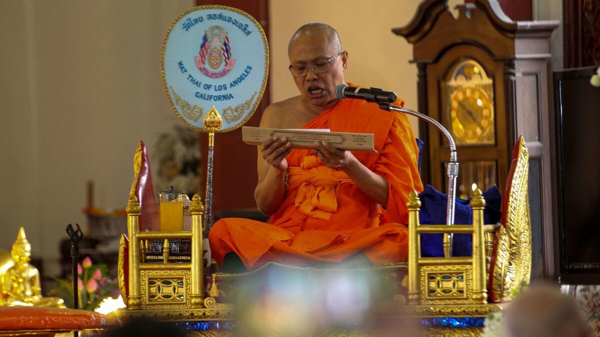 Buddhist priest Pra Kyu Vinai Thorn Kittisak, flown in from Thailand, performs 100-day death anniversary services at Wat Thai Temple in North Hollywood.