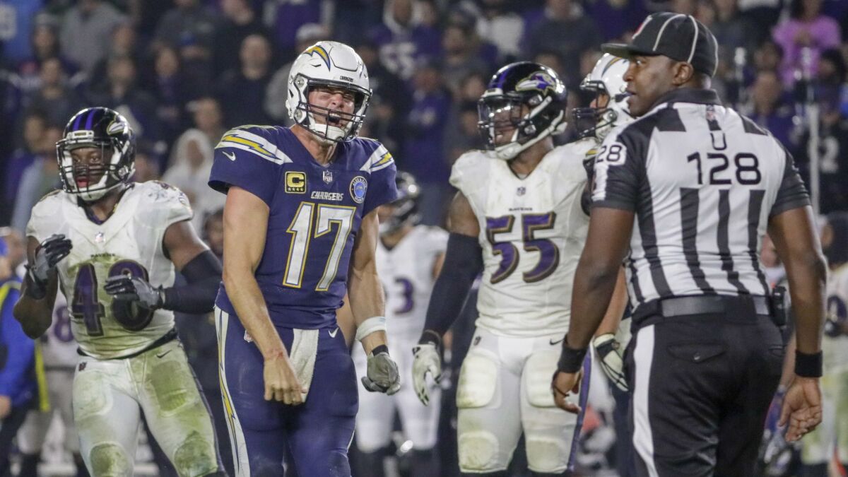 Chargers quarterback Philip Rivers yells at referee Ramon George late in the game against the Ravens on Dec. 22, 2018.