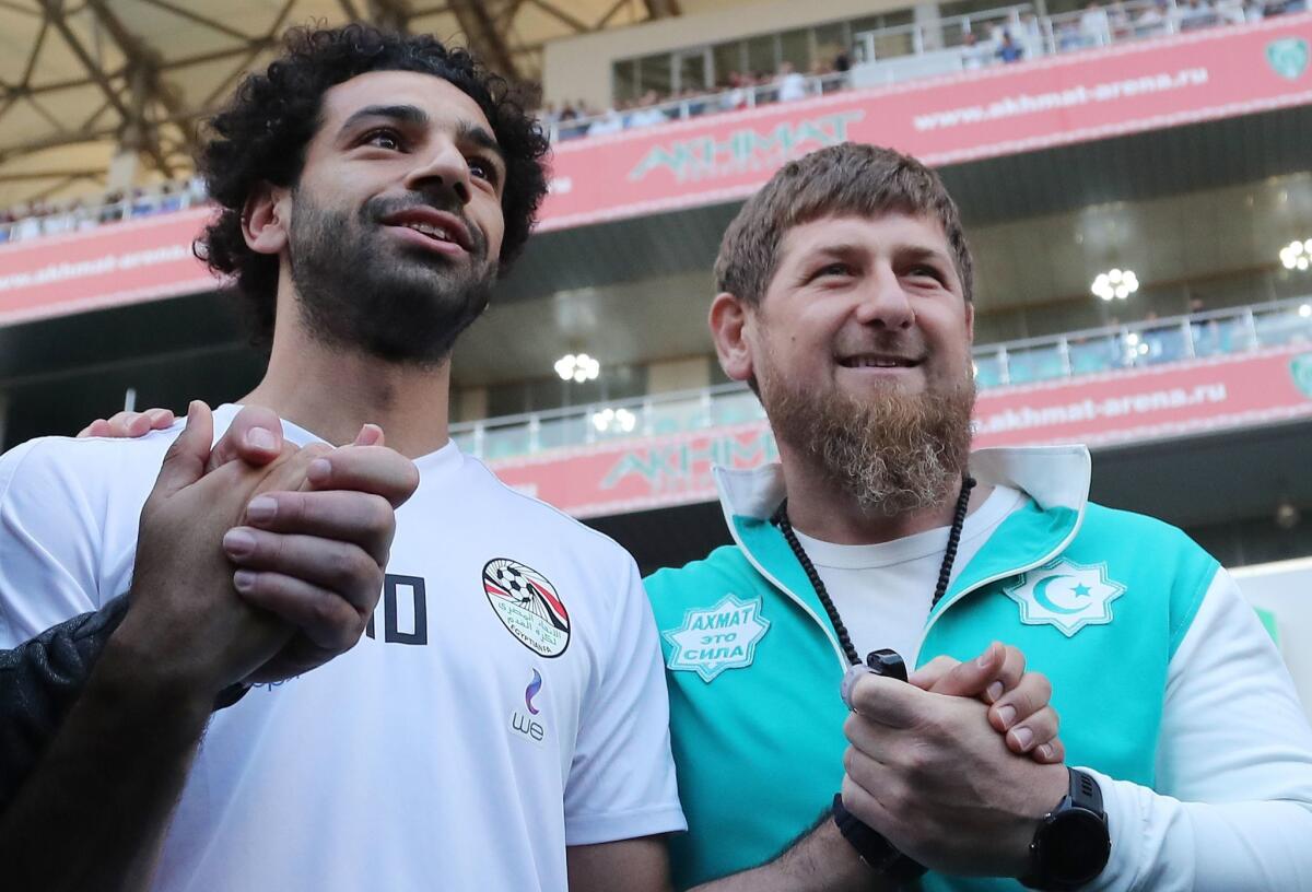 Egypt striker Mohamed Salah poses head of the Chechen Republic Ramzan Kadyrov while training in Grozny on June 10.