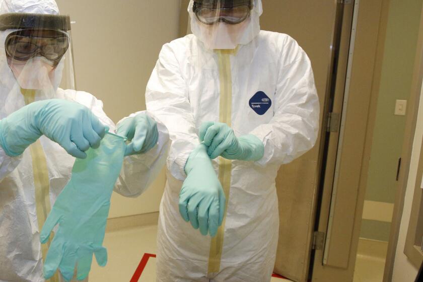 Protective gloves, gowns, masks and booties are discarded after use, contributing to the large amount of medical waste produced by treating Ebola.
