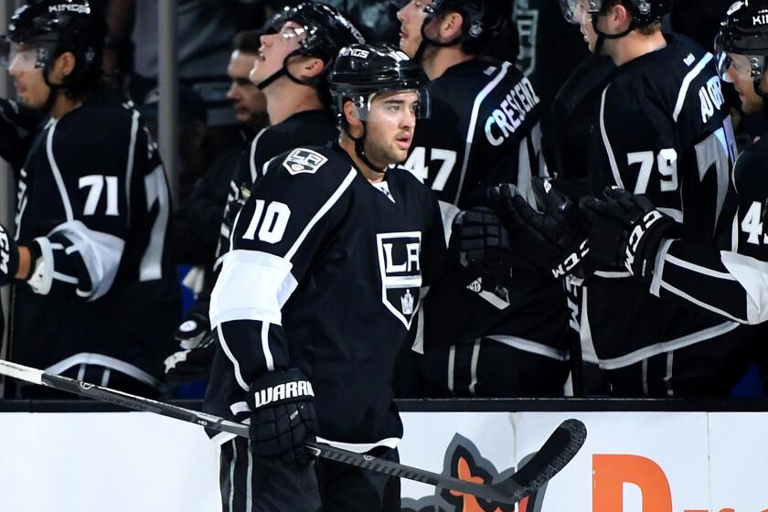 Kings winger Devin Setoguchi is congratulated by teammates after scoring against the Ducks in a preseason game Sept. 28.