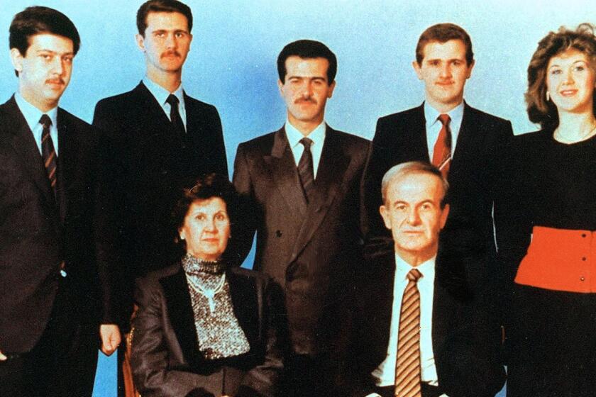 Publicity photo from the Nat Geo News documentary, "The Assads: Inside Syria's Deadly Dynasty. Undated picture shows Syrian President Hafez al-Assad and his wife Anisseh posing for a family picture with his children (L to R) Maher, Bashar, Bassel, who died in a car accident in 1994, Majd and Bushra. (Photo credit should read LOUAI BESHARA/AFP/Getty Images)