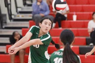 Taylor Yu passes to teammate Elizabeth Hung during Temple City’s nonleague match against Pasadena.