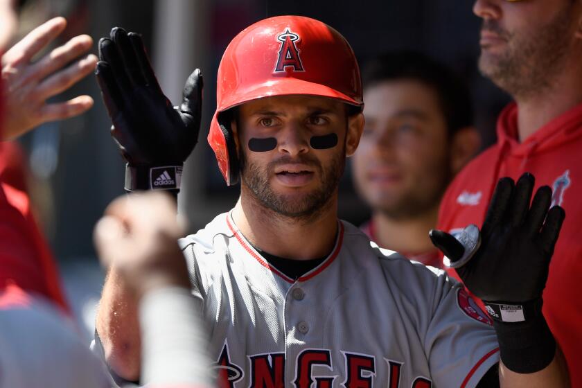 MINNEAPOLIS, MN - MAY 15: Tommy La Stella #9 of the Los Angeles Angels celebrates a solo home run against the Minnesota Twins during the third inning of the game on May 15, 2019 at Target Field in Minneapolis, Minnesota. (Photo by Hannah Foslien/Getty Images)
