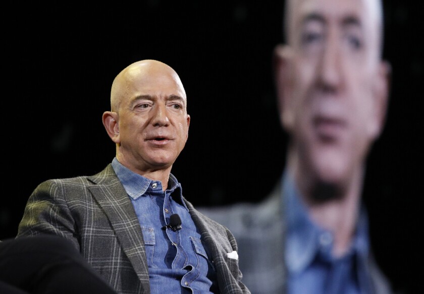 FILE - In this June 6, 2019, file photo Amazon CEO Jeff Bezos speaks at the the Amazon re:MARS convention in Las Vegas. The Amazon founder officially stepped down as CEO on Monday, July 5, 2021, handing over the reins as the company navigates the challenges of a world fighting to emerge from the coronavirus pandemic. Andy Jassy, the head of Amazon’s cloud-computing business, replaced Bezos, a change the company had announced in February. (AP Photo/John Locher, File)