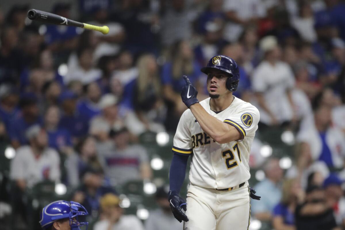 Milwaukee Brewers' Willy Adames tosses his bat after hitting a three-run home run during the eighth inning of a baseball game against the Chicago Cubs, Monday, June 28, 2021, in Milwaukee. (AP Photo/Aaron Gash)