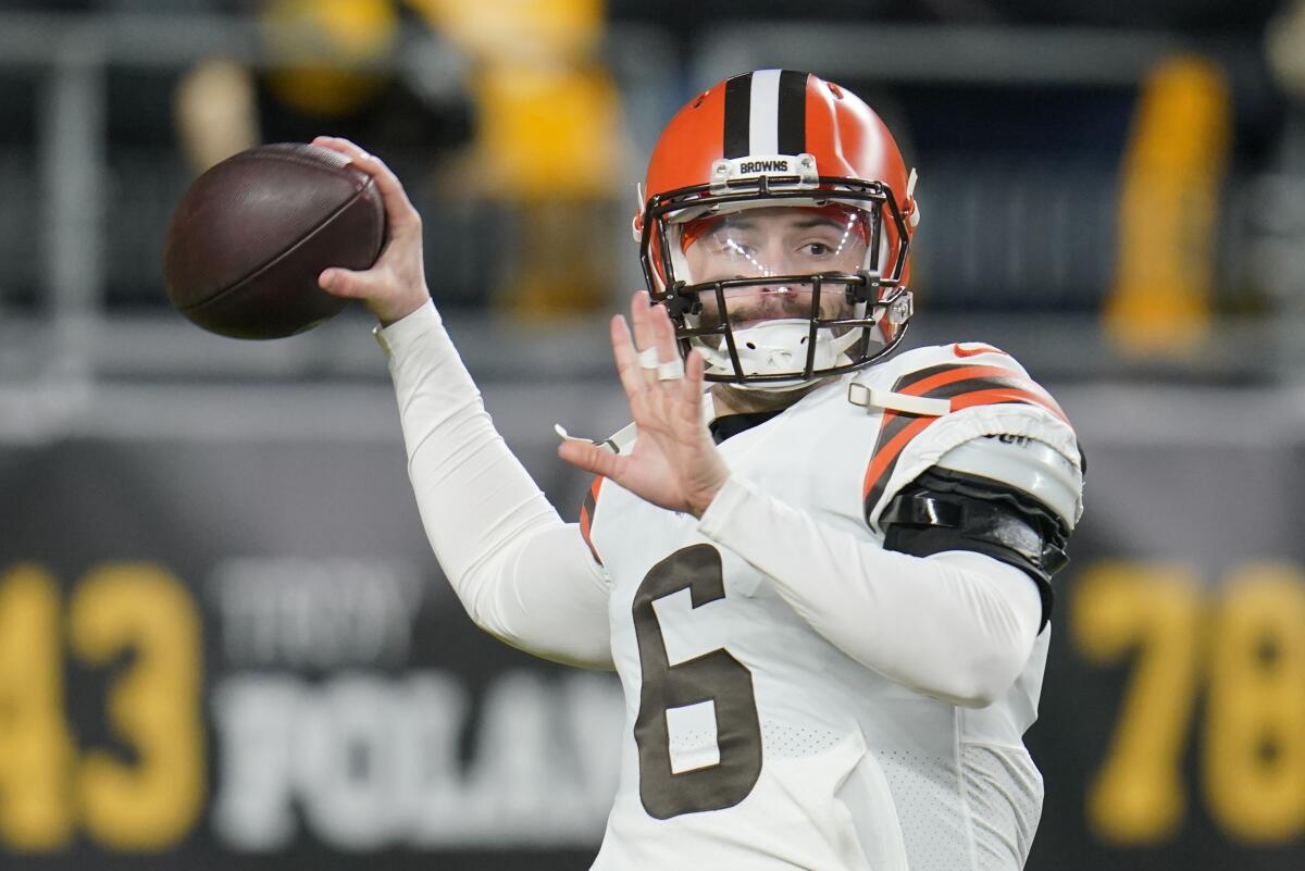 FILE - Cleveland Browns quarterback Baker Mayfield (6) warms up before an NFL football game against the Pittsburgh Steelers, on Jan. 3, 2022, in Pittsburgh. Mayfield's rocky run with Cleveland officially ended Wednesday, July 6, 2022, with the Browns trading the divisive quarterback and former No. 1 overall draft pick to the Carolina Panthers, a person familiar with the deal told the Associated Press. (AP Photo/Gene J. Puskar, File)