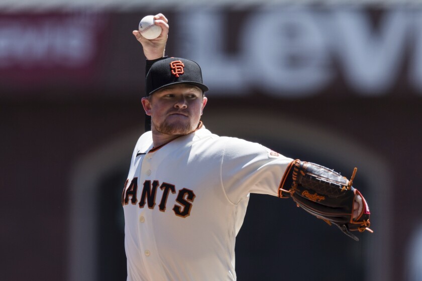 San Francisco Giants starting pitcher Logan Webb throws against the Texas Rangers during the first inning of a baseball game in San Francisco, Tuesday, May 11, 2021. (AP Photo/John Hefti)