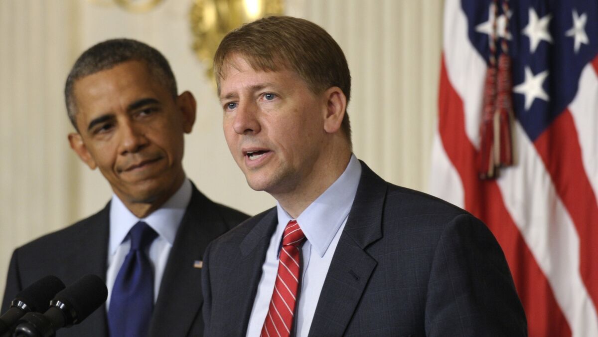 Richard Cordray, right, director of the Consumer Financial Protection Bureau, speaks at the White House last week, as President Obama listens.