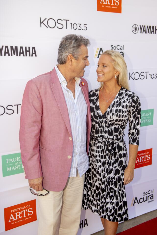 Christopher and Cara Knight pose for photos on the red carpet of the Celebrity Benefit at Festival of Arts and Pageant of the Masters on Saturday in Laguna Beach.