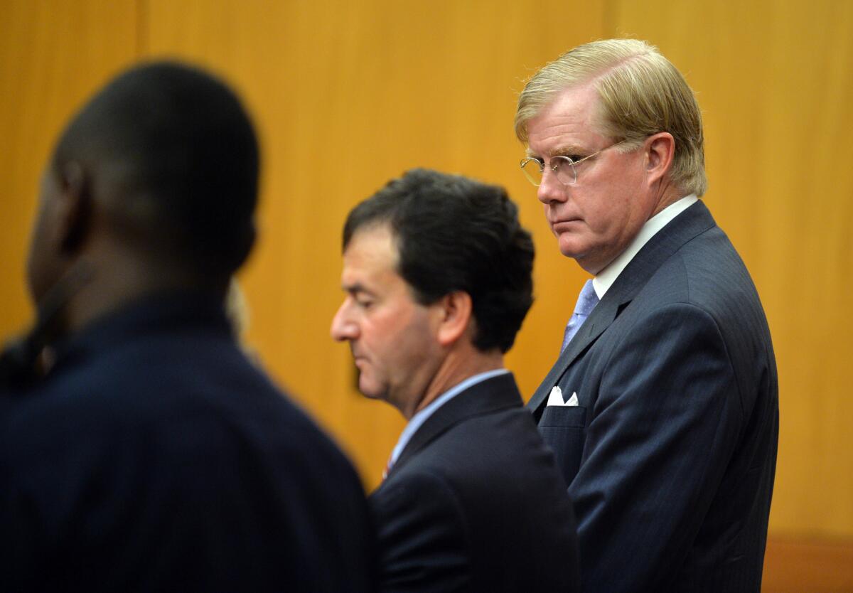 U.S. District Court Judge Mark Fuller, right, appears in Fulton County Court Sept. 5 to face charges of misdemeanor battery, in Atlanta.