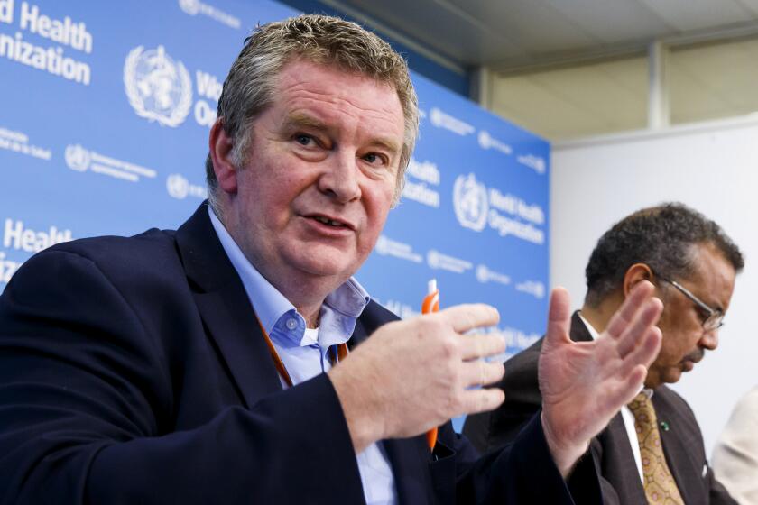 FILE - In this Wednesday, Feb. 5, 2020 file photo, Dr. Michael Ryan, executive director of the World Health Organization's Health Emergencies program, speaks during a news conference at the WHO headquarters in Geneva, Switzerland. At right is WHO Director-General Tedros Adhanom Ghebreyesus. As WHO faces allegations that unnamed staffers were involved in the systemic sexual abuse of women, Tedros has declared he was “outraged,” and Ryan said, “We have no more information than you have.” But an AP investigation has found that senior WHO management was not only informed of specific cases of alleged sexual misconduct in 2019, but was asked how to handle them. (Salvatore Di Nolfi/Keystone via AP)
