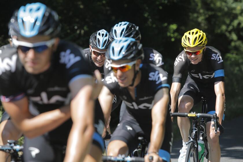 Tour de France overall leader Chris Froome, far right, goes on a training ride with his teammates during a rest day on Monday.
