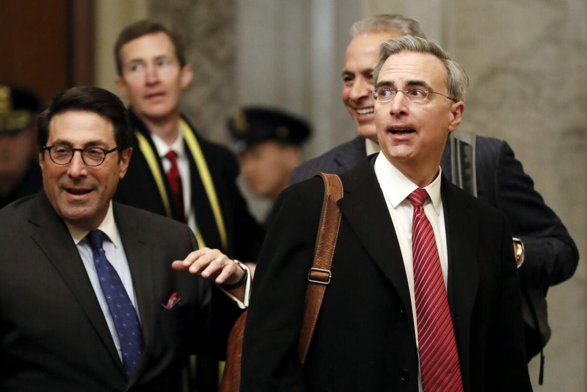  Jay Sekulow, left, walks with White House Counsel Pat Cipollone, right