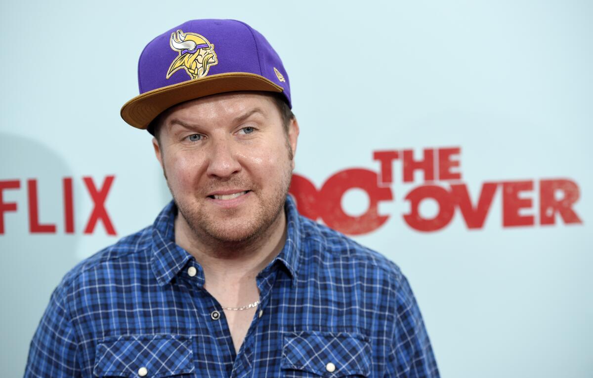 Nick Swardson in a purple hat at a Netflix event.