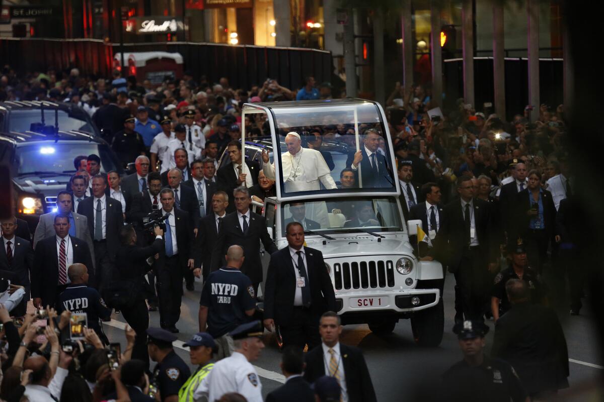 Pope Francis arrives at St. Patrick's Cathedral in Manhattan to an enthusiastic crowd.