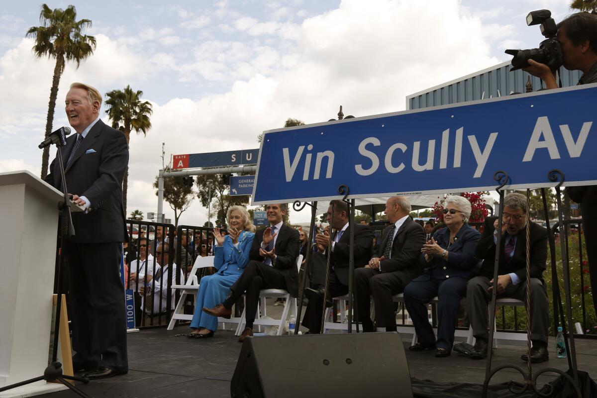 Vin Scully speaks during a ceremony held for his long-time service to the Los Angeles Dodgers.